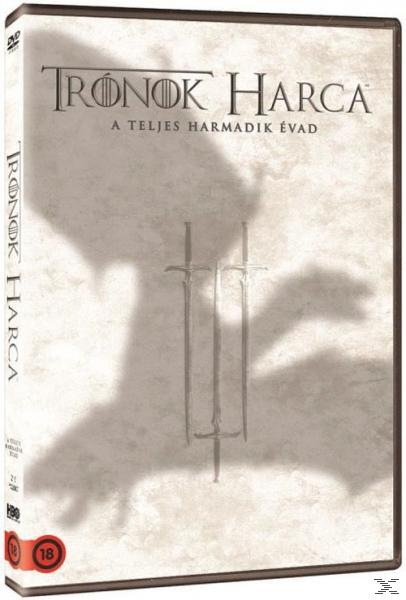 DVD borító három karddal és egy sárkány árnyékával. Szöveg középen. A DVD egy tokban van.
