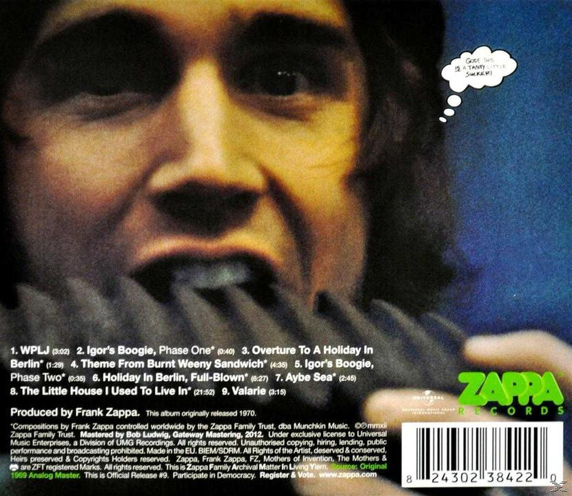 CD-Cover mit dem Gesicht eines Mannes und einer Titelliste. Eine Cartoon-Denkblase sagt „So lecker, Idiot!“.