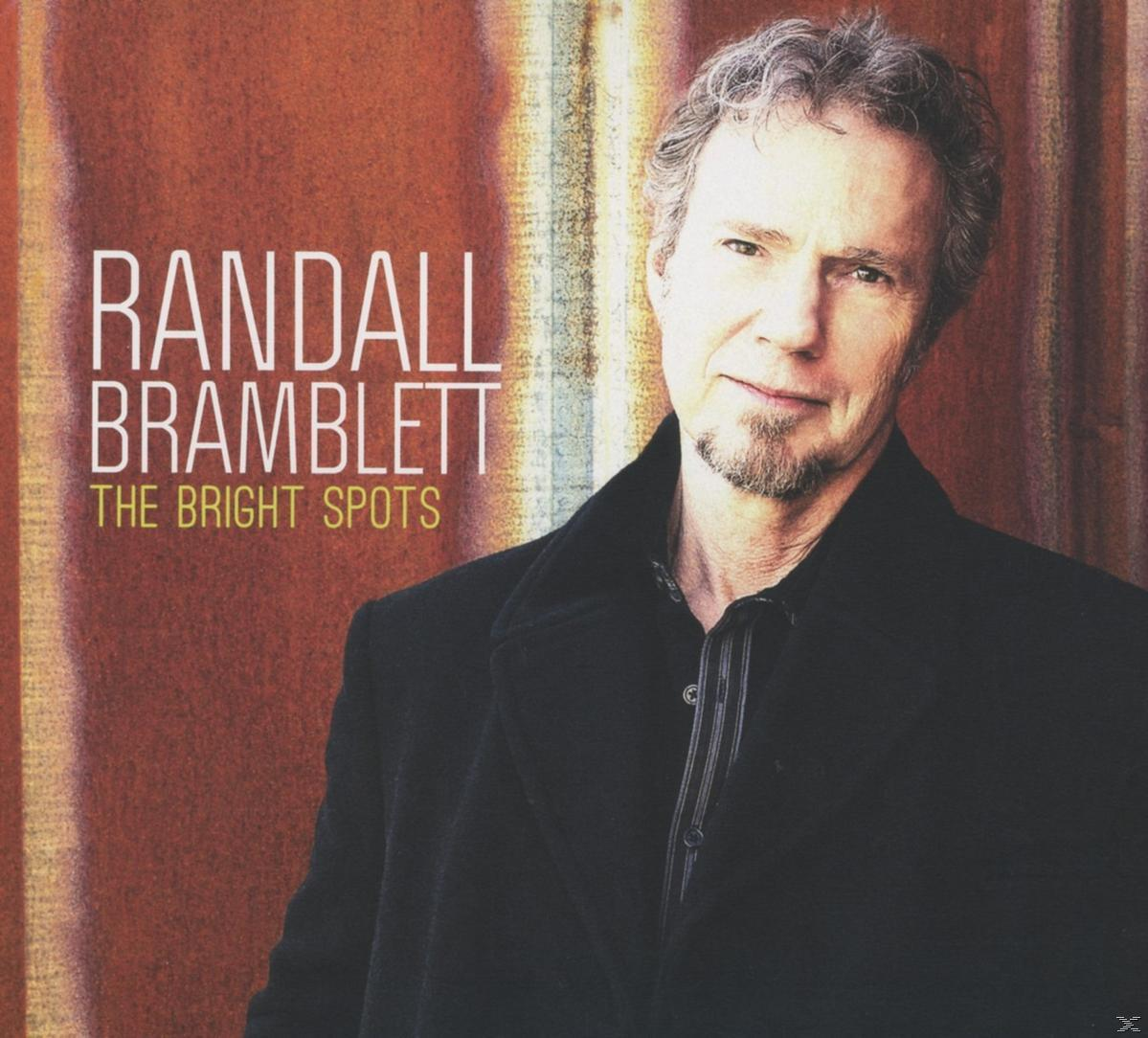 Album borító: Randall Bramblett, The Bright Spots. Fekete kabátos férfi, barna háttér.