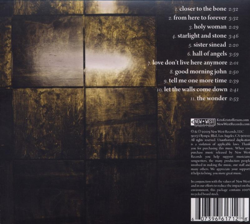 Az album hátlapja rácsmintával. A dalok címei és a szöveg listázva van. A háttér sötét és texturált.