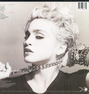 Madonna-Albumcover, Schwarzweiß. Portrait von Madonna mit Kette und Mikrofon.