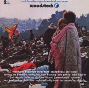 A Woodstock fesztivál album borítója. Emberek egy mezőn, egy sárkány és egy előadói lista a háttérben.