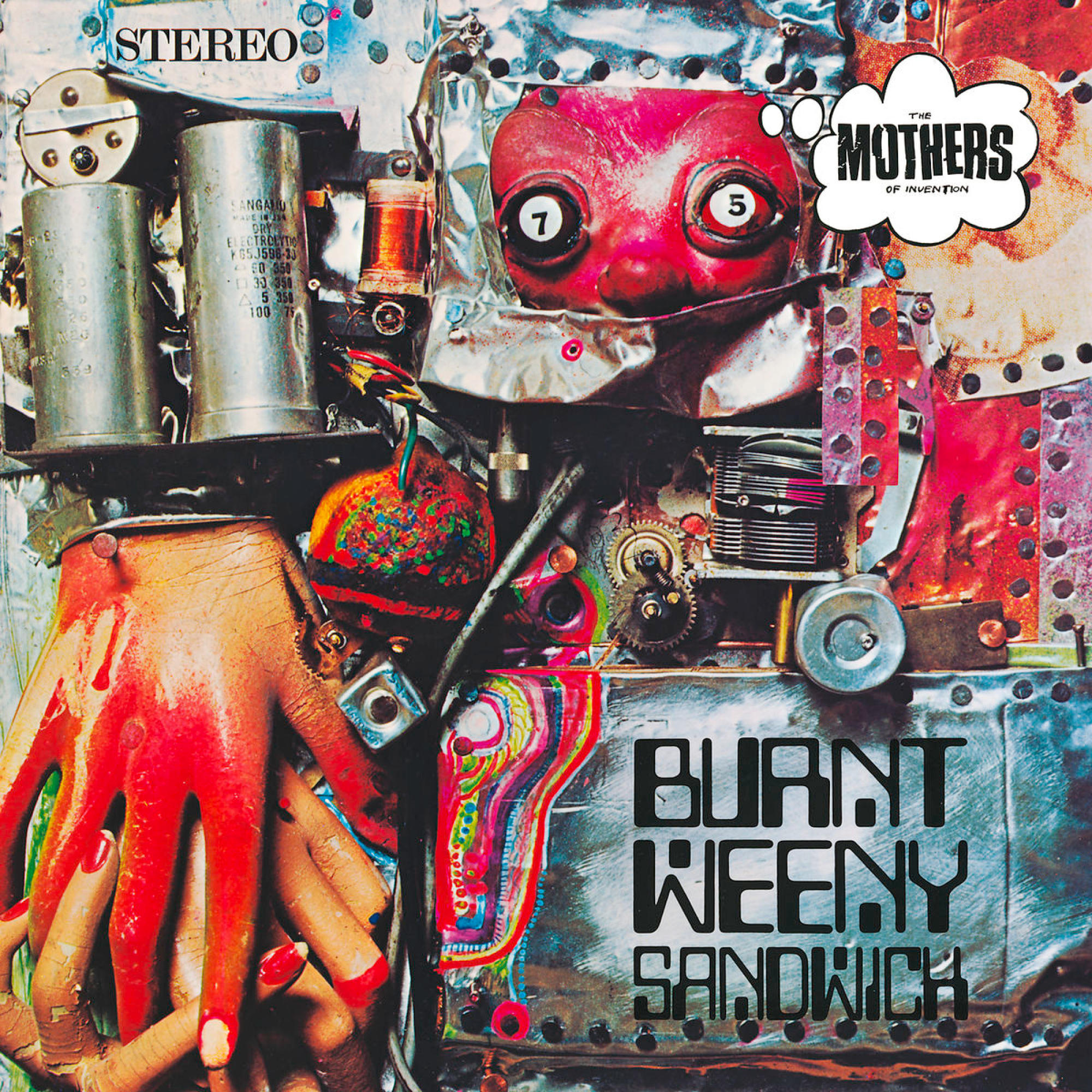 Albumcover: Collage aus Metall, einem Gesicht, einer Hand und fettem Text.