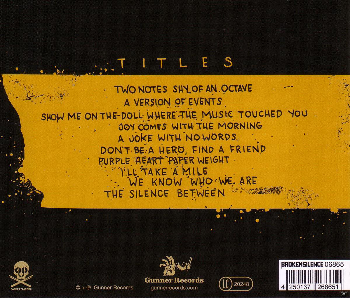 Album-Rückseite mit Songtiteln in Gelb auf schwarzem Hintergrund, mit dem Bandlogo.