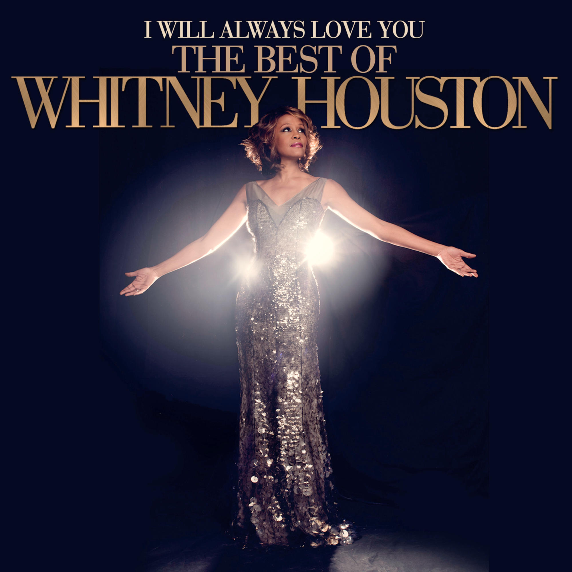 La pochette de l'album du meilleur de Whitney Houston. Whitney Houston est sur le devant, les bras ouverts.