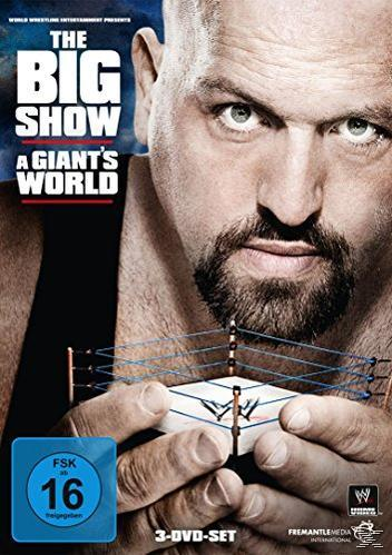 Mann hält ein Wrestling-Ring-Modell. Der Text lautet 'The Big Show - A Giant's World'.