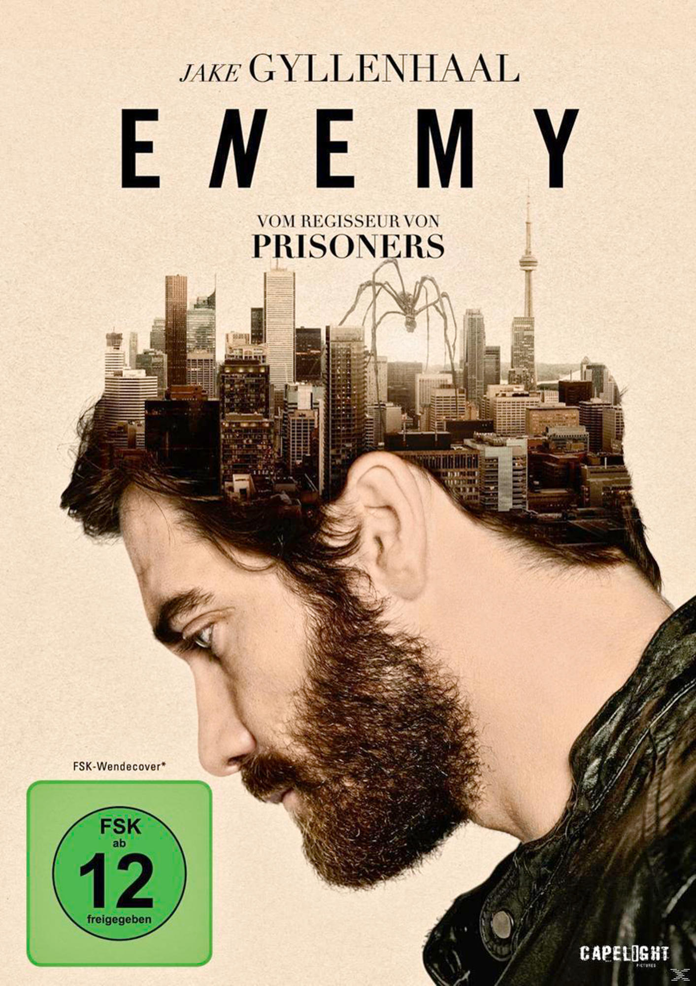 Filmplakat mit dem Gesicht eines Mannes und einer Stadt in seinem Kopf. Der Filmtitel lautet Enemy.