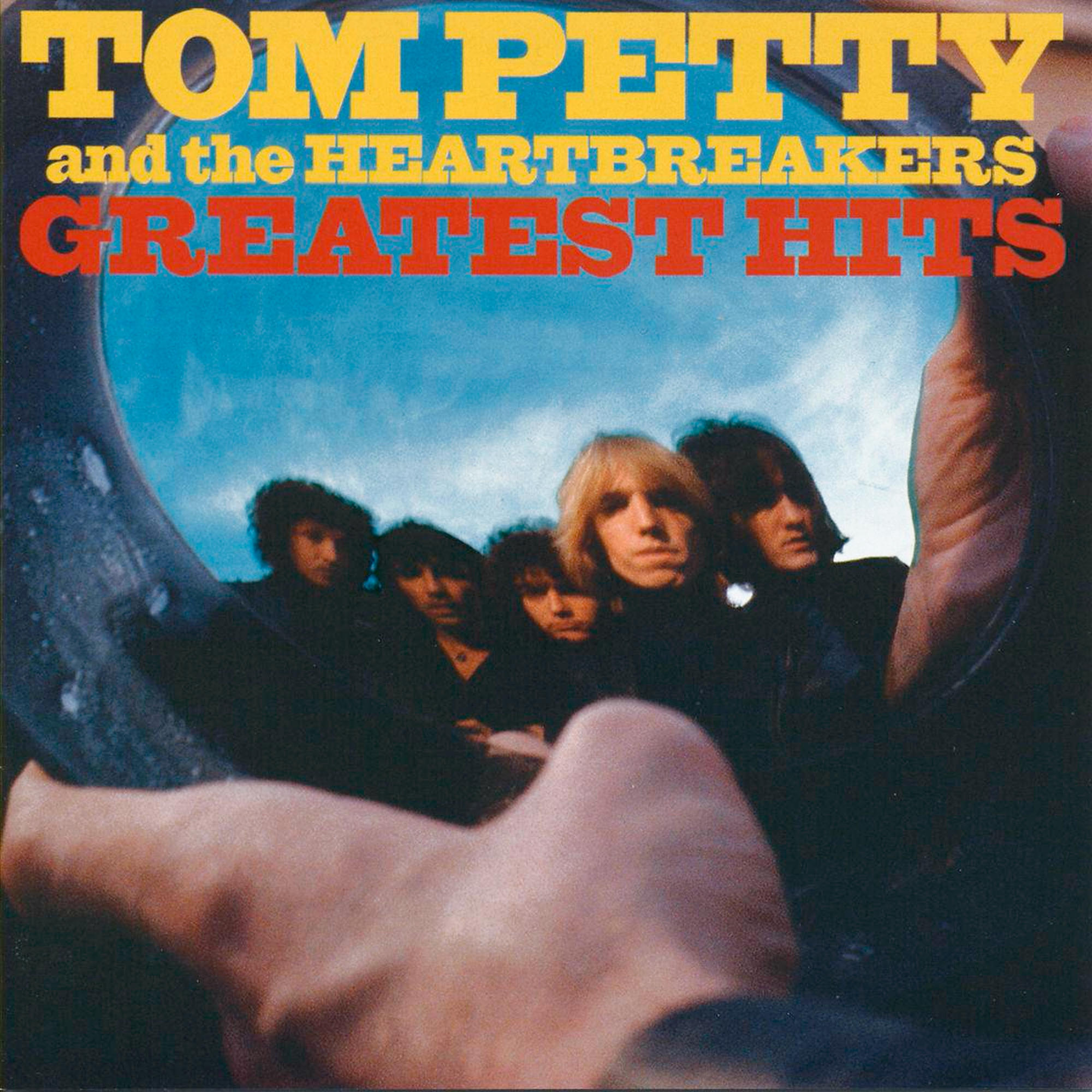 Tom Petty and the Heartbreakers Greatest Hits CD. Albumhoes met bandfoto en blauwe lucht.