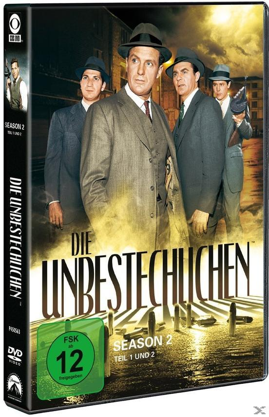 DVD-Cover: Die Unbestechlichen, eine Gruppe von Männern in Anzügen, Stadt im Hintergrund.