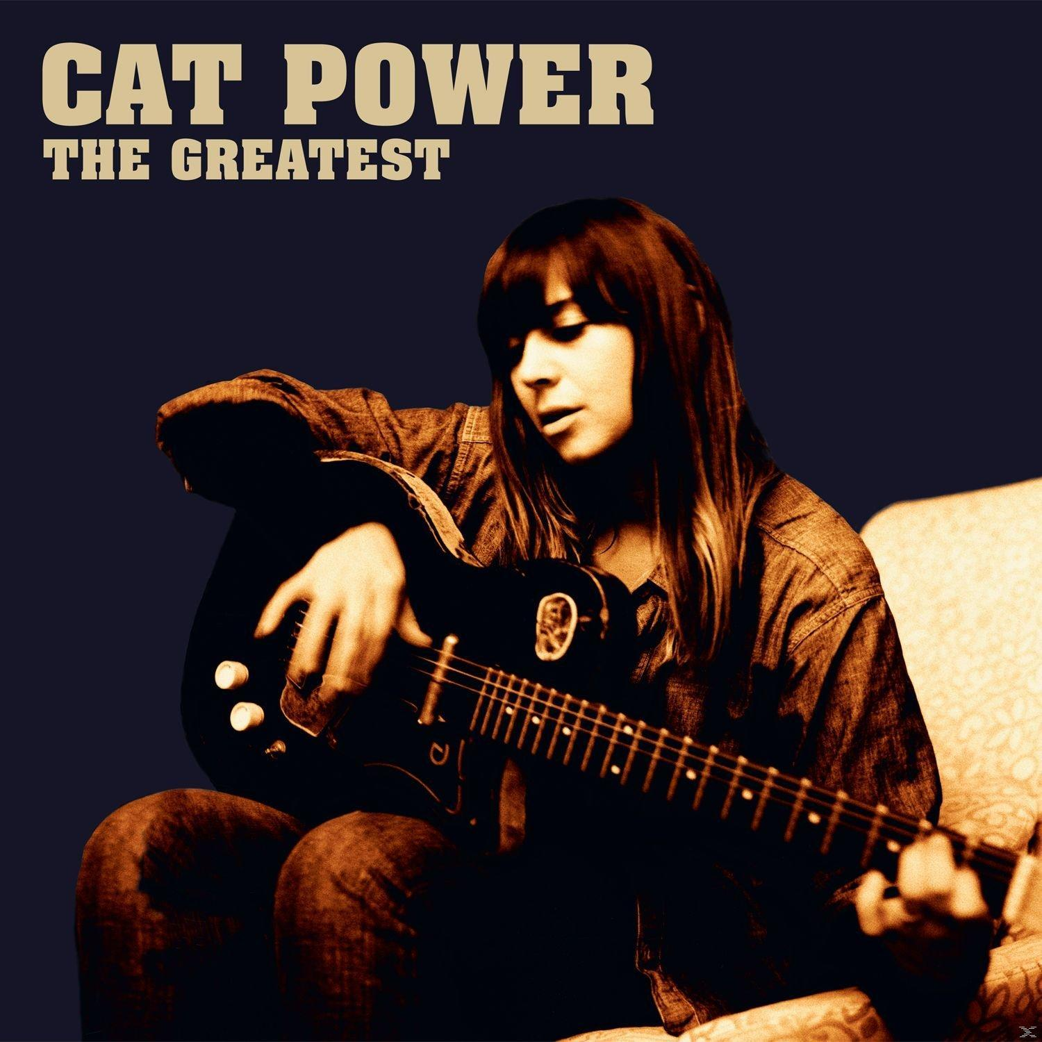 Eine Frau mit einer Gitarre sitzt auf einem Sofa. Das Cover sagt "Cat Power The Greatest".