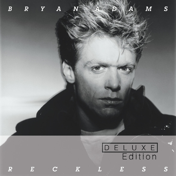 Schwarzweiß-Albumcover mit einem Porträt von Bryan Adams und dem Wort Reckless, Deluxe Edition.