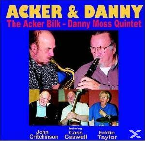 Albumcover mit vier Musikern, zwei spielen Instrumente.