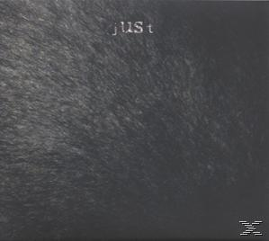 Albumcover: Grauer Hintergrund mit dem Wort „just“ in Weiß oben.