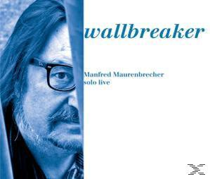 Albumcover: blau getöntes Bild eines Mannes, Brille, Text.