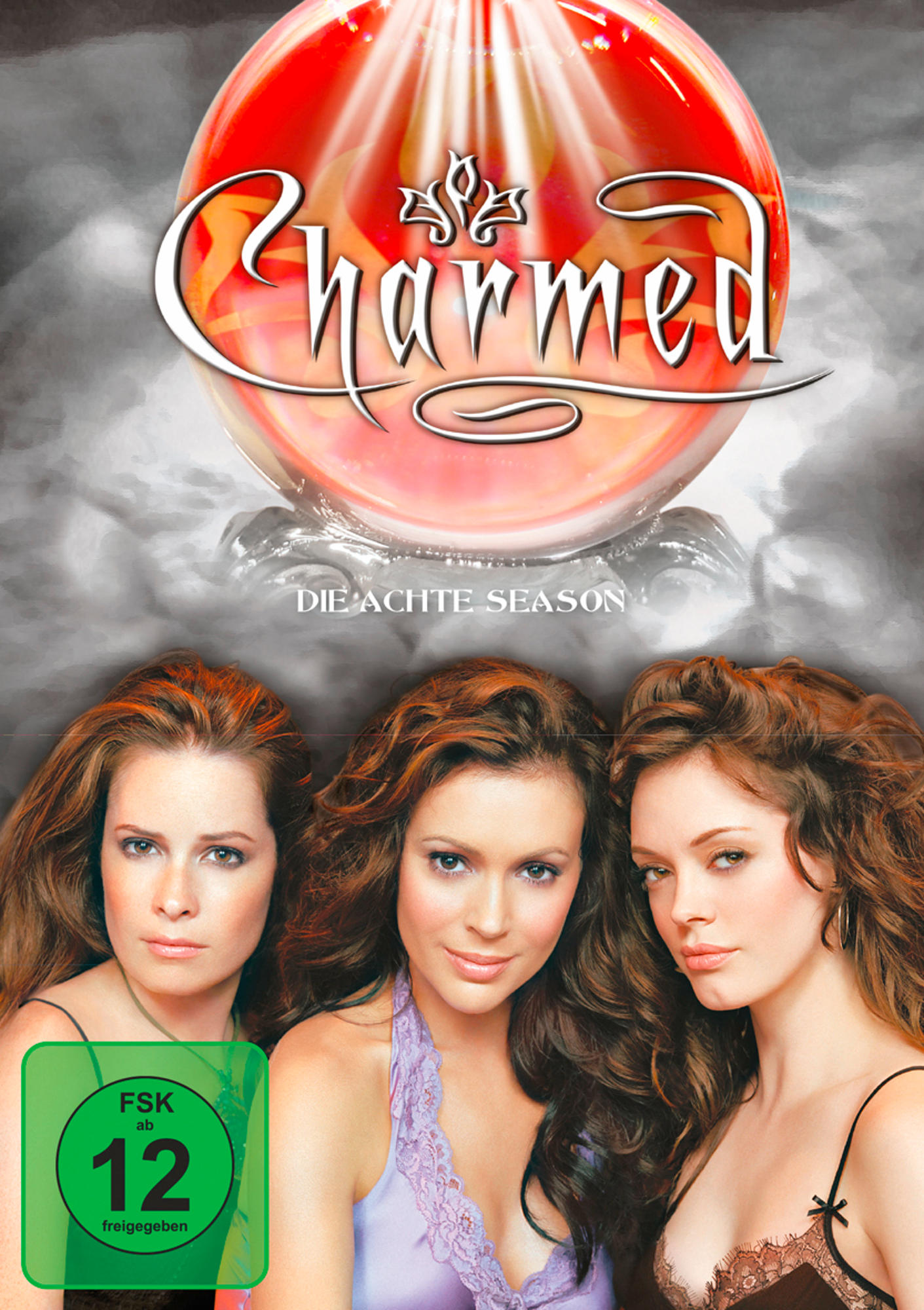 DVD-Cover von 'Charmed' mit drei Frauen und einer großen roten Kugel über ihnen.