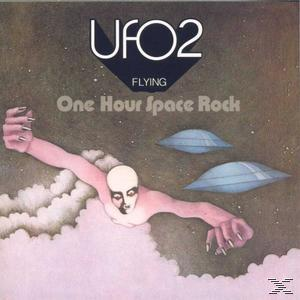 Albumcover, eine fliegende Figur mit zwei UFOs. Der Hintergrund ist ein Weltraumthema.