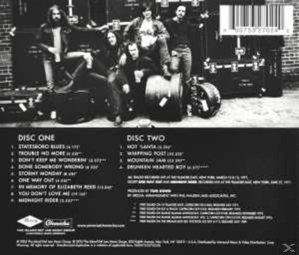 Album-Rückseite mit Bandfoto und Titellisten.