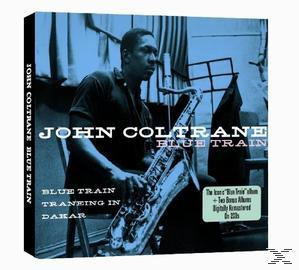 Albumcover von John Coltrane. Er hält ein Saxophon. Titel: Blue Train. Hintergrund: Blau, mit Vorhängen und einem Notenständer.