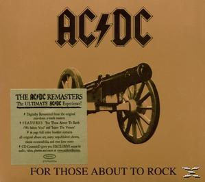 AC/DC-Albumcover: eine Kanone mit dem Bandlogo darüber und ein Werbeheft links.