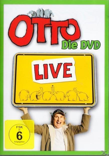 DVD-Cover mit einem Mann, der ein Schild mit der Aufschrift "LIVE" hält. Hintergrund: gelbes Schild, Elefanten und ein grüner Rand.