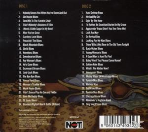 CD borító tracklistákkal angolul, ággyal és papucsokkal egy leopárdmintás takarón a háttérben.