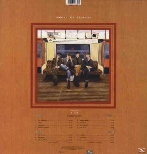 Albumcover mit Bandmitgliedern in einem Zug. Titel: „Modern Life Is Rubbish“.