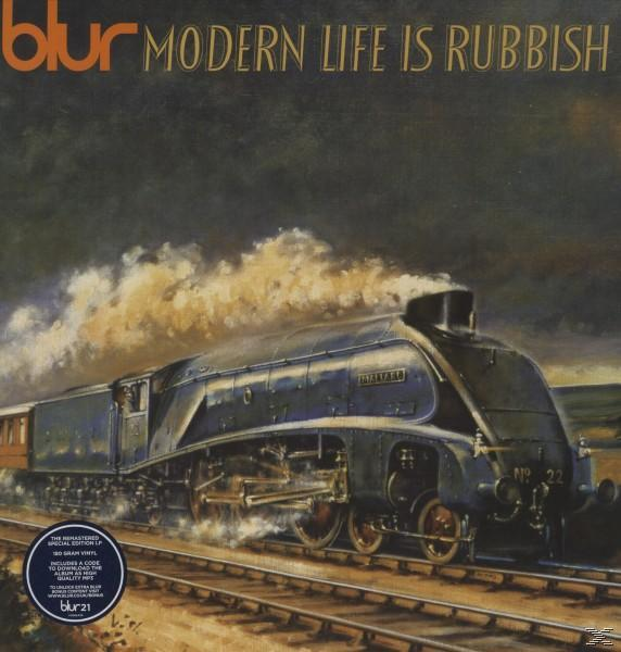 Albumcover mit einem Dampfzug auf den Gleisen und dem Text 'Modern Life Is Rubbish'.