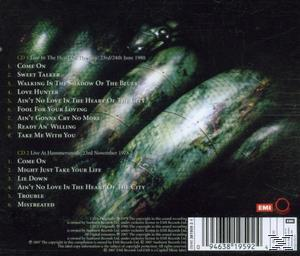 Rückseite einer CD. Mit einer Reihe von grünen, strukturierten Formen und Titellisten.