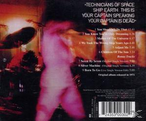 CD-Rückseite. Verschwommenes Bild einer Band. Text listet Songtitel und Credits auf.