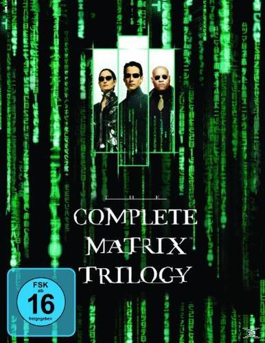 DVD-Cover: Die Matrix-Trilogie mit drei Personen in Schwarz, grüner Code-Hintergrund.