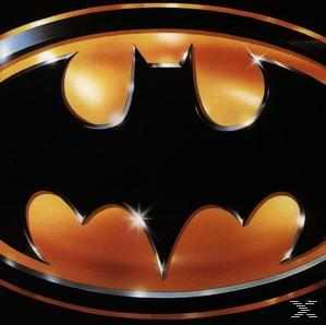 A Batman logó, egy denevér sziluett arany metál designban fekete háttéren.