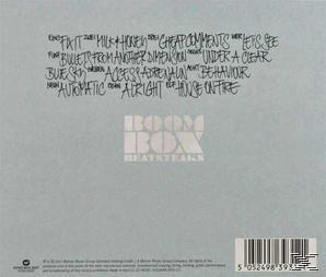 Albumcover. Listet Songs auf. The Boom Box Heatbeats. Weißer Hintergrund mit handschriftlichem Text und einem Barcode.