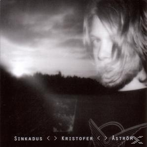 Schwarzweiß-Albumcover mit einem Männergesicht und unscharfem Hintergrund.
