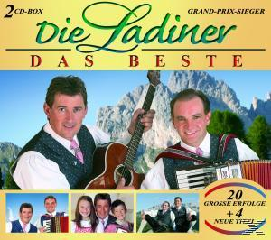 Albumcover: Zwei Männer in traditioneller Kleidung. Berg und Text überlagert auf gelbem Hintergrund.