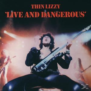 Albumcover: Ein Mann, der auf der Bühne Bassgitarre spielt, mit den Worten 'Live and Dangerous'.