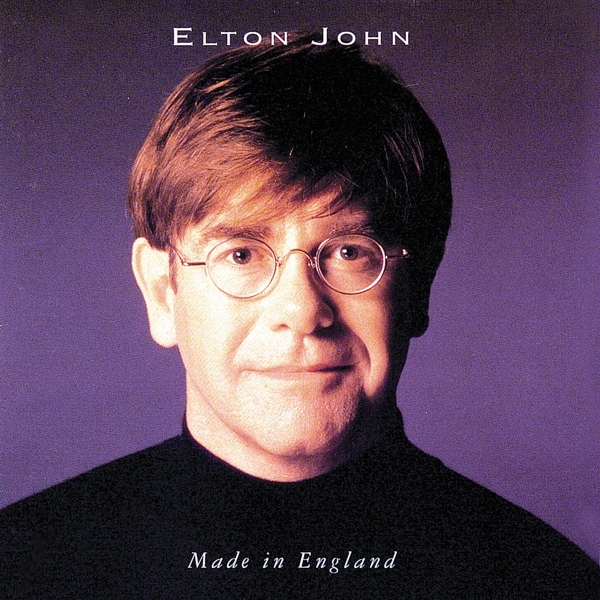 Albumcover mit Elton Johns Gesicht, Brille, schwarzes Hemd, lila Hintergrund.