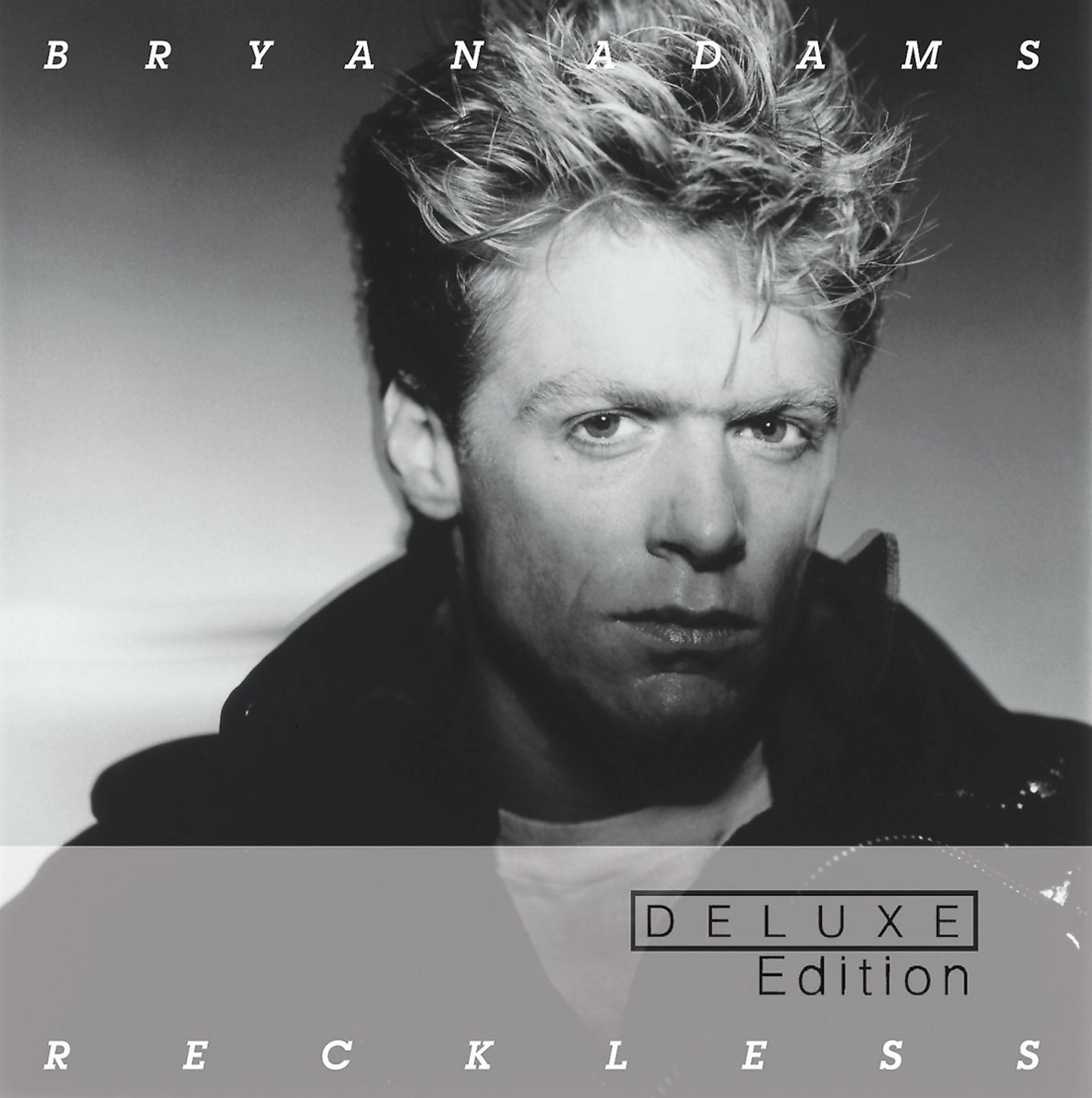 Albumcover für Bryan Adams' Reckless Deluxe Edition. Zeigt eine Nahaufnahme von Bryan Adams.