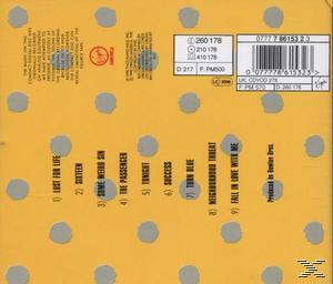 Album-Rückseite mit gelbem Hintergrund, grauen Punkten, Titelliste und Barcode.