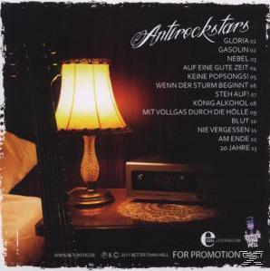 Rückseite eines Albumcovers mit Lampe, Gitarre und Stereoanlage. Der Text enthält Songtitel und Credits. Dunkle Umgebung.