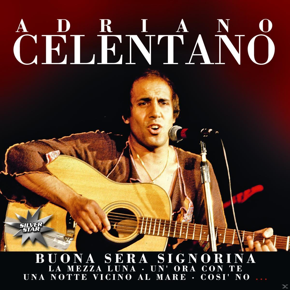 Albumcover: Adriano Celentano mit Gitarre, der in ein Mikrofon singt. Dunkler Hintergrund.