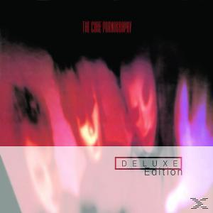 Albumcover für 'The Cure: Pornography'. Rote, rosa und schwarze verschwommene abstrakte Kunst wird angezeigt.