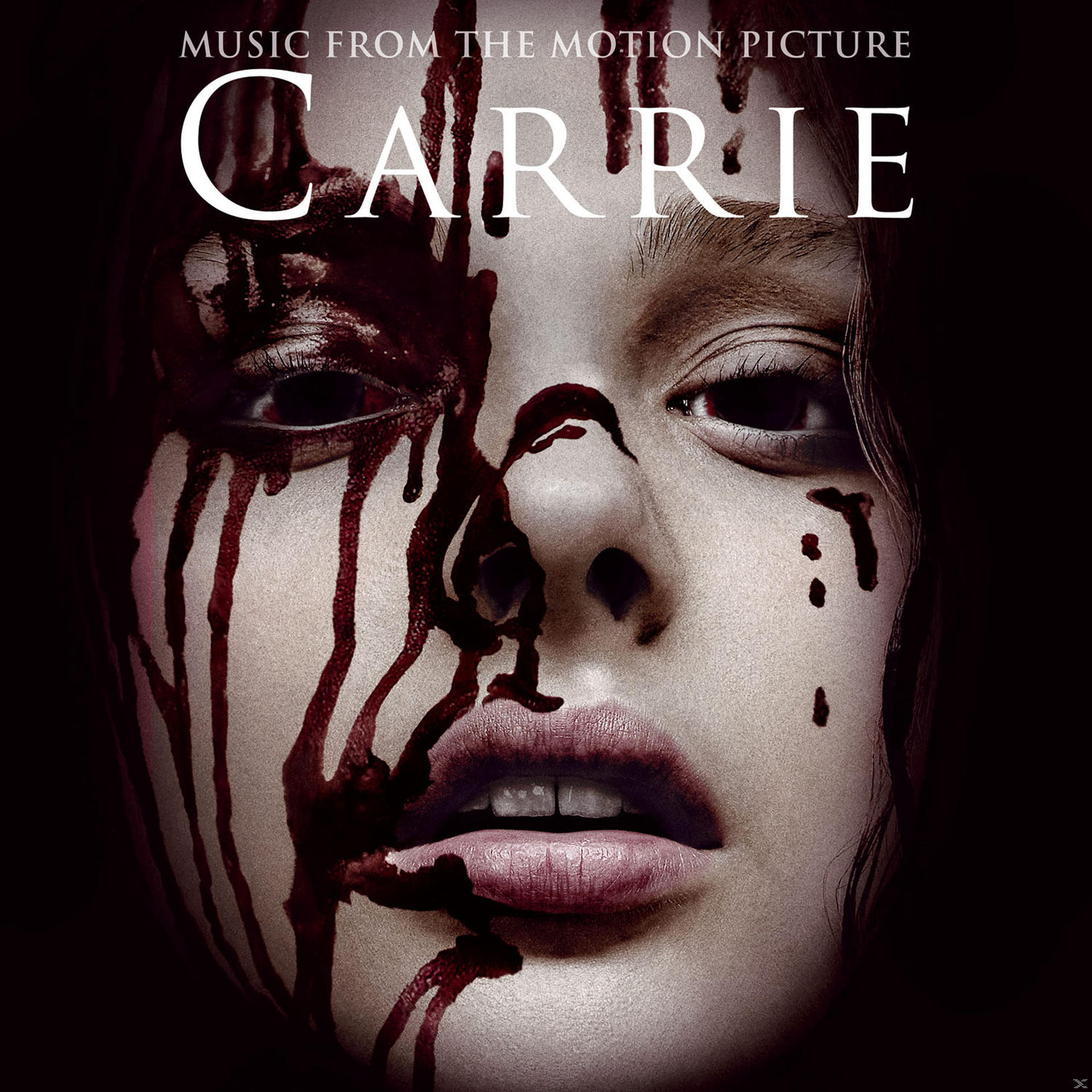 A 'Carrie' film album borítója, egy vérrel borított női arccal.