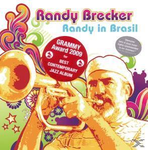 Albumcover eines Mannes, der Trompete spielt, mit Grammy-Award-Aufkleber und farbenfrohem Design.