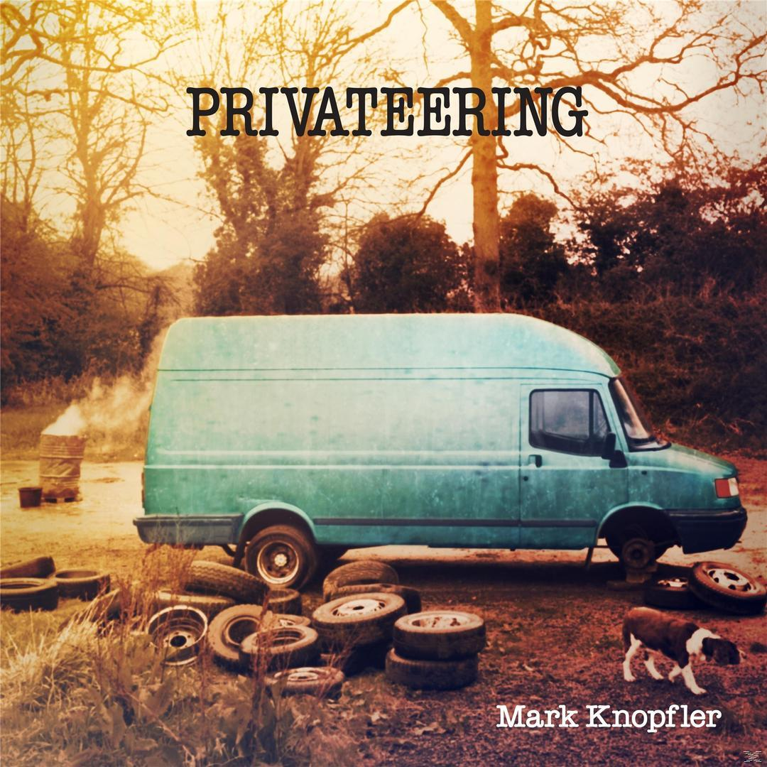 Ein blauer Van auf einer unbefestigten Straße, mit Reifen und einem Hund. Titel: 'Privateering'.