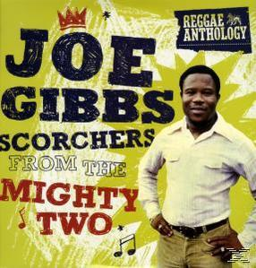 Albumcover für Joe Gibbs mit einem Mann in einem weißen Hemd, der lächelt, mit Text im Hintergrund.