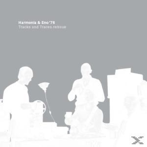 Albumcover. Zwei weiße Silhouetten vor grauem Hintergrund. Text: Harmonia & Eno '76 Tracks and Traces Reissue.