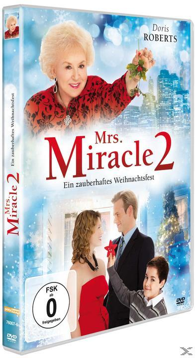 DVD-Hülle für Mrs. Miracle 2, mit einer Frau, die Mistelzweige hält. Andere Personen und eine Skyline sind im Hintergrund zu sehen.