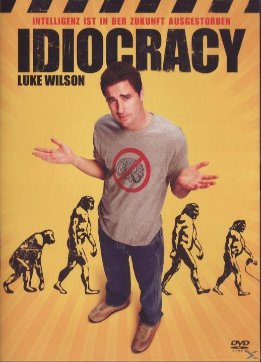 Filmplakat für Idiocracy. Luke Wilson steht vor Evolution Zeichnungen.