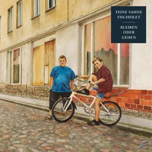 Albumcover. Zwei Jungen mit Fahrrad auf der Straße. Einer sitzt drauf.