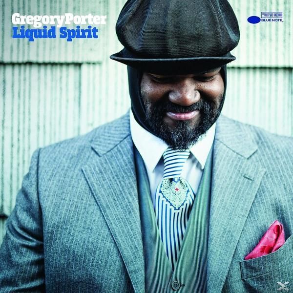 Gregory Porter Albumcover: Mann im Anzug, Hut und Krawatte, lächelnd.